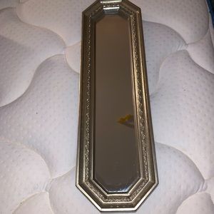 Slender mirror with golden trim
